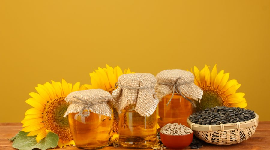 sunflowers and 3 jars of sunflower oil